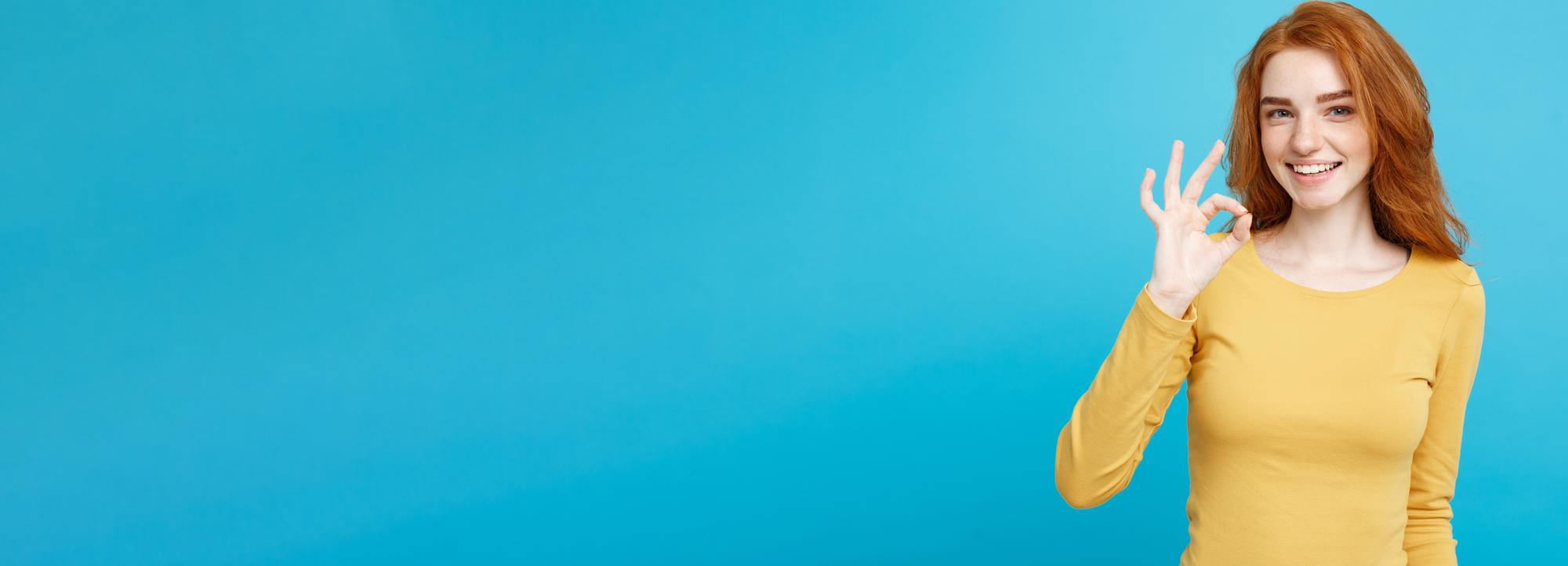 lady smiling with blue background