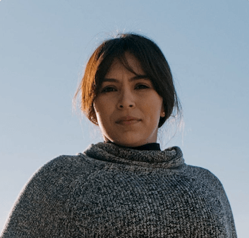 Womenis looking straight in to the camera