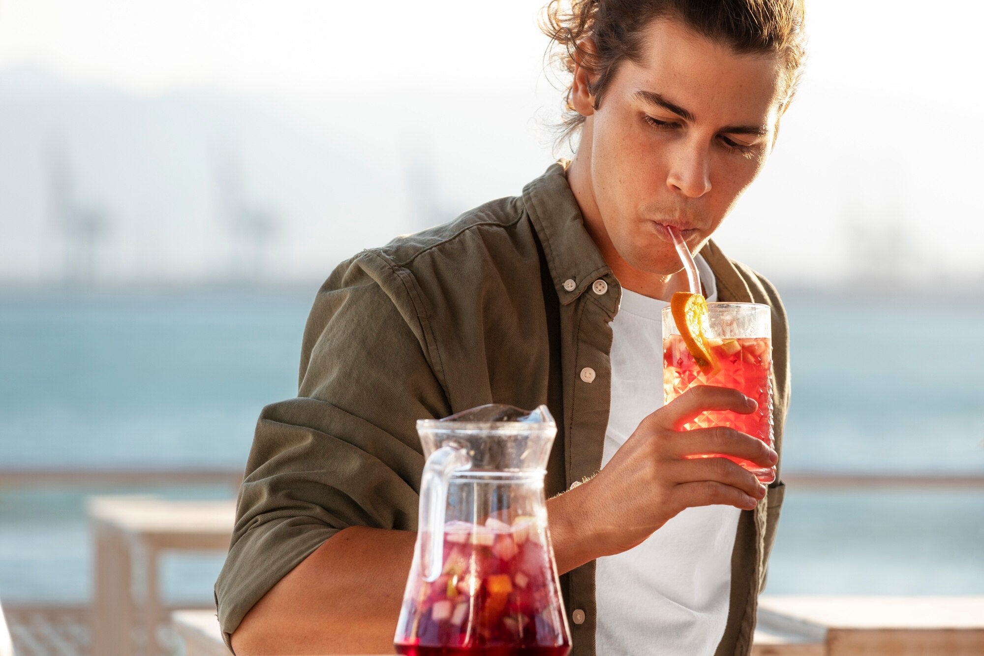 medium shot man drinking sangria