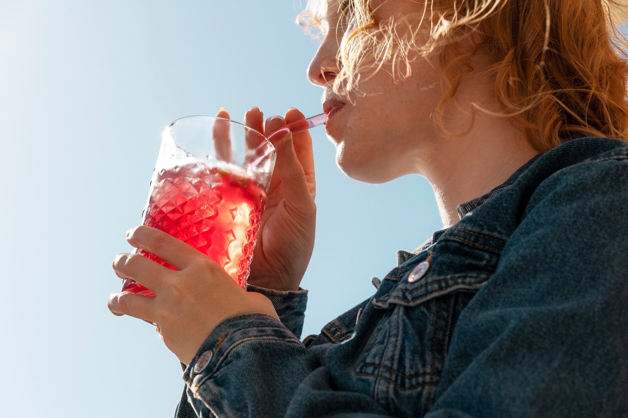 side view woman drinking
